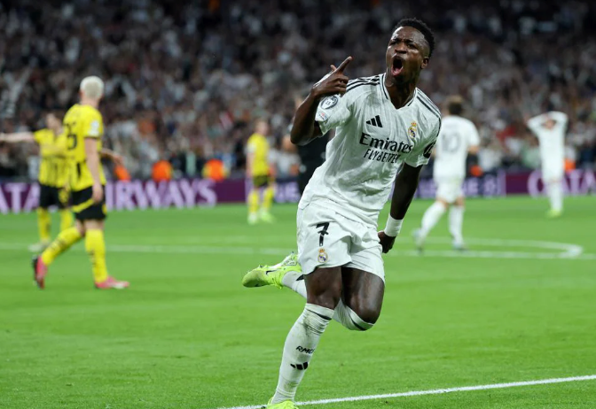 Vinicius hat-trick earns comeback against Dortmund