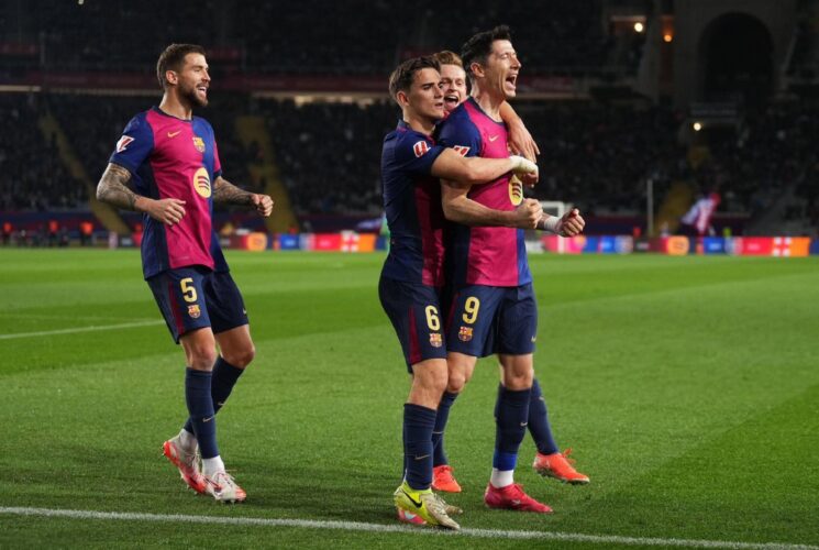 Barca tops La Liga with win over Vallecano